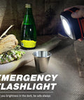 Hand holding Two Pack Folding Solar Lantern Flashlights Kit Mini Collapsible USB Rechargeable Waterproof Hanging Lights shining on items.