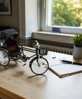 Vintage Metal Tricycle Model With Heavy Duty Aluminum Alloy Build And Old School Three Wheel Rickshaw Design on a wooden table.