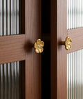 Premium Solid Brass Gold Cabinet Knobs With Cherry Blossom Flower Design on wooden cabinet doors