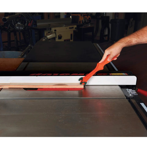 Get A Grip TPR Push Stick With Reversible Notches And Bright Orange Grip For Safer Woodworking And Precise Control Twelve And Three Quarters Inch Length being used on a table saw