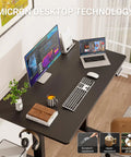 47.2 Inch Standing Desk With Adjustable Height And Wood Top For Home Office And Gaming setup with monitor, laptop, and accessories