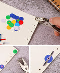 All In One Dope Craft Fasteners Set From Mudder With 100 Brass Paper Fasteners And 300 Colorful Washers Plus 1 Hole Punch For Scrapbooking DIY Projects And School Supplies in use with hole punch and fasteners on paper.