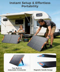 Man setting up 100W Foldable Portable Solar Panel With Five In One Cable for off grid power next to RV