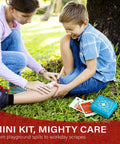 Everlit Pocket-Aid mini first aid kit, blue hard-shell case with 50 items, outdoor park scene