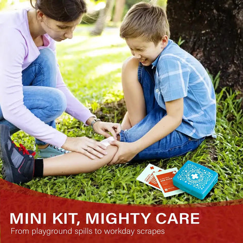 Child receiving care with Grab And Go Pocket First Aid Kit With A Compact Hard Shell Case And 50 Essentials Per Pack, in outdoor setting.