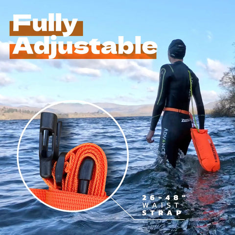 Person using Open Water Swim Buoy With 15L Dry Bag and Rest Handle, Fully Waterproof Swim Bubble, high visibility orange