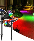 Solar Spotlights Outdoor 600LM Set Of 2 Waterproof Landscape Lights for yard pathway with rainbow illumination effect at night.