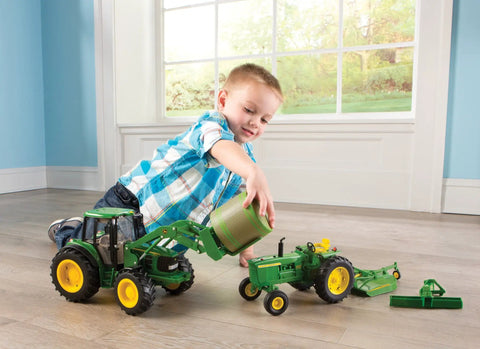Child playing with Big Farm 7330 Tractor With Front Bale Mover And Bale Realistic Lights And Sounds Durable Toy Vehicle indoors