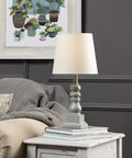 Distressed Blue Resin Table Lamp 18.5 Inch Tall Dope Modern Living Room Accent Lighting with soft ambient glow on nightstand