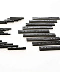 Assorted black heat shrink tubes from 2 To 1 Heat Shrink Tubing Kit For Wires And Cables, 127 Piece Assortment Of Wire Wrap Sleeve In Seven Sizes