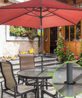 Patio Table Umbrella Hole Wedge Plugs And Stabilizer Sleeve Set For Two To Two And A Half Inch Table Holes And One And A Half Inch Umbrella Poles Cone Ring Stabilizer Black Two Pack in use on outdoor glass table setup