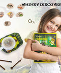 Smiling child holding Hands On Dino Fossil Dig Kit For Kids Ages 5 To 7 And 8 To 12 with tools and 3D T-Rex skeleton box