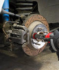 Using Pro Grade Wheel Hub Cleaning Kit With Half Inch Drive Impact Socket And 2 Inch Abrasive Pads on brake hub