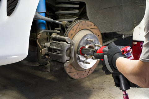 Using Pro Grade Wheel Hub Cleaning Kit With Half Inch Drive Impact Socket And 2 Inch Abrasive Pads on brake hub