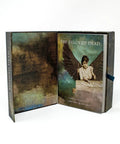 The Beloved Dead Oracle Deck & Guidebook For Divine Ancestral Wisdom, 82 Cards And 144 Page Full Color Manual displayed open.