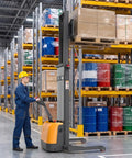 Rugged Heavy Duty Electric Lithium Pallet Stacker Cranks Up To 3300 Lbs With A Snappy 98 Inch Lift Height operating in a warehouse.