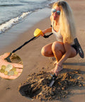 Heavy Duty Serrated Edge Metal Detecting Shovel With Belt Loop Sheath, Beast Digger used by woman on beach