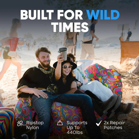 People sitting on No Pump Setup Inflatable Couch Lounger for Beach Camping Festivals and Tailgates with psychedelic print.