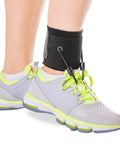 Foot Drop Brace With Dorsiflexion Support For Men And Women on ankle, fits in shoes, adjustable design for mobility.