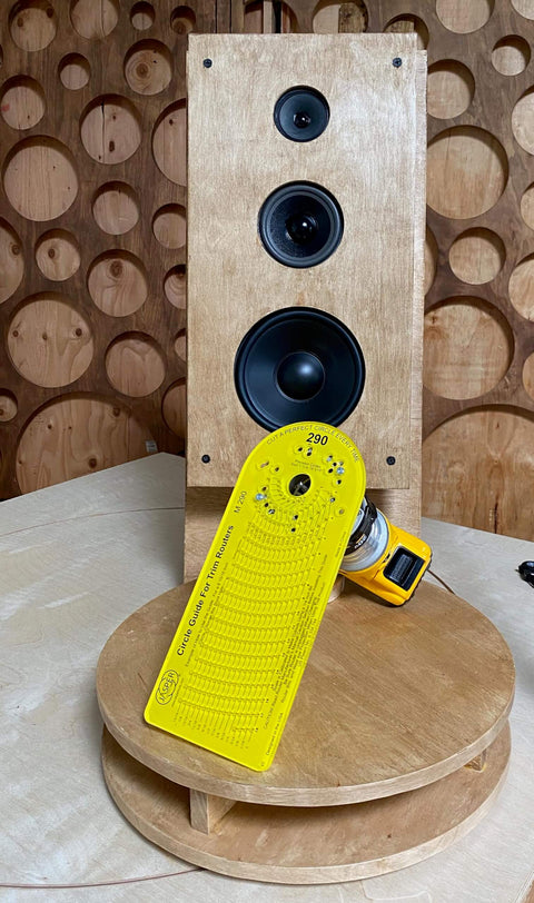 Grade A Circle Jig For Woodworking Delivers 268 Circle Cuts From One And A Half Inches To Eighteen And Three Sixteenths Inches In One Sixteenth Increments Compatible With Standard And Pro Router Models Killer For Speaker Cutouts Rings And Inlays Works, shown in front of a wooden speaker panel.
