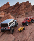 One Sixth Scale SCX6 Jeep Wrangler 4x4 Rock Crawler RTR With Two Speed Transmission And Beefed Up Front And Rear Suspension, AR90 Axles, Silver Finish, Batteries And Charger Not Included on rocky terrain with other RC models