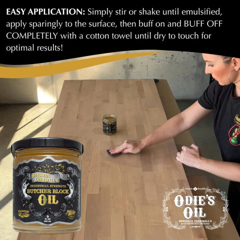 Woman applying Industrial Strength Butcher Block Oil For Cutting Boards And Countertops on wooden surface