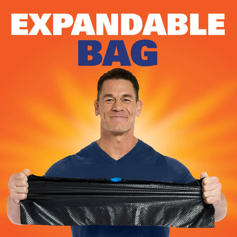 Person holding an expandable Ultra Strong 13 Gallon Black Trash Bags Tall Kitchen Garbage Bags With Drawstring Enclosure.