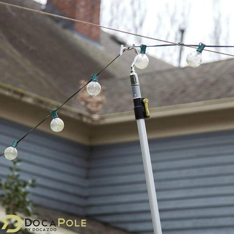 Boat Hook Head Only No Pole For Docking And Debris Cleanup shown lifting holiday lights