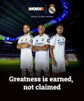 Three soccer players in white Real Madrid jerseys in a stadium, "Greatness is earned, not claimed" text at the bottom.