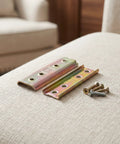 Sectional Sofa Connectors For Stable Interlocking In Small Apartments, 2 Pack Iron Couch Frame Hardware, burrfree surfaces shown on fabric.