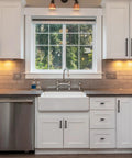 Modern kitchen with Oil Rubbed Bronze Cabinet Pulls 5 Inch 10 Pack, featuring white cabinets and stainless steel appliances.