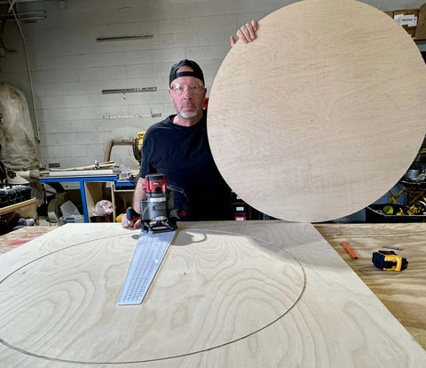 Man using Circle Cutter Router Jig For Precise Circle Cuts From Seven To Fifty Two And Three Quarters Inches in workshop