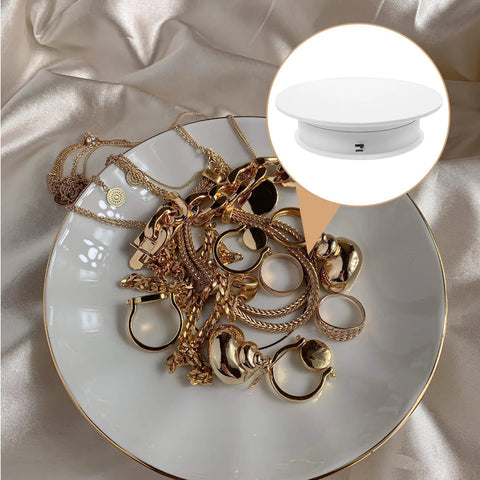 Spinning Electric Jewelry Display Rotating Turntable Adjustable Velocity Stand For Photo Shoots And Tabletop Showcase With Anti Skid Base with gold jewelry on white plate