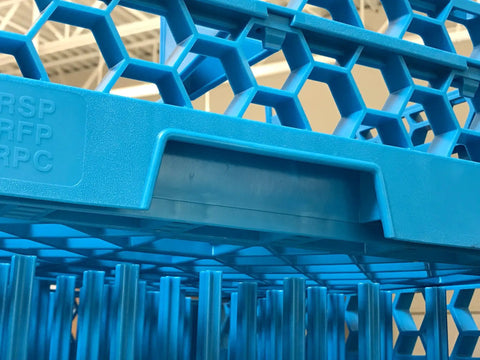 Close-up of OptiClean NeWave 20-Compartment Glass Rack With 2 Extenders, Polypropylene, holds 20% more glassware, in blue.