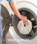 Person placing reusable white mop pad into washing machine, demonstrating Heavy Hitter Microfiber Spin Mop And Bucket Set Including Three Extra Washable Replacement Pads For Fast Dirt Trapping And No Sweat Floor Mopping Quick Dry Finish On Hardwood.