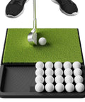 Patented All In One Pro Grade Golf Practice Mat with Built In Ball Tray holding 32 balls, putter, and golfer's feet visible