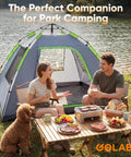 Two Person No Fuss Instant Camping Tent With 60 Second Setup And Pre Attached Pole by a lake with people and picnic setup