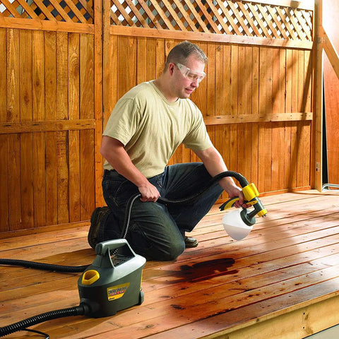 Person using Control Spray Max HVLP Paint Sprayer For DIYers And Pros Corded Turbine Sprayer Delivers Smooth Finish On Deck