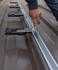 Top Shelf Micro Inverter With Standard Mc4 Connectors Designed For 320 To 540 Watt Solar Panels, person adjusting connector on solar panel rail.