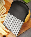 Crinkle cutter with stainless steel ridged blade and ergonomic black handle for vegetables and potatoes