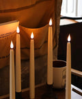 Dope Cone Shaped Flameless Window Candles 12 Pack LED Battery Powered Timed Warm Light With 3D Wick, Plastic Base on table