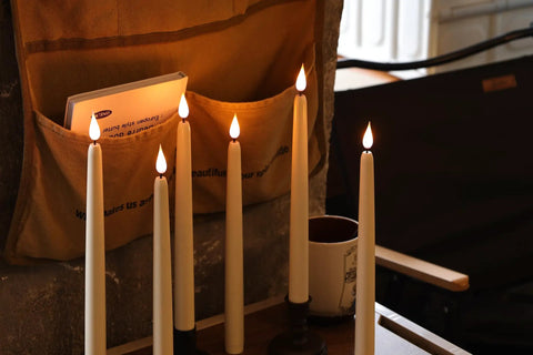 Dope Cone Shaped Flameless Window Candles 12 Pack LED Battery Powered Timed Warm Light With 3D Wick, Plastic Base on table