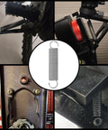 Close-up of Mcredy stainless steel extension spring with dual hooks, 0.4 x 2 in, two-pack.