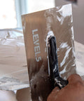 Flex Drywall Curved Trowel 12-Inch By 4.75-Inch With 0.5mm Blade smoothing plaster on wall surface