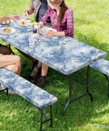 Cute Dragonfly 3 Piece Picnic Table Cover Set With Waterproof Bench Covers on a picnic table in an outdoor setting.