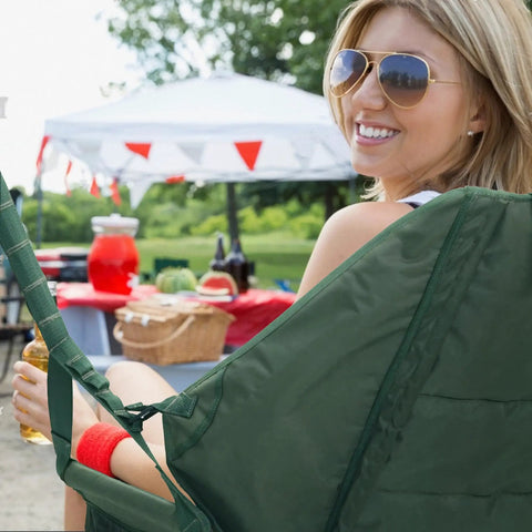 Woman relaxing in a Hanging Hammock Chair For Patio With Plush Headrest And Armrests Outdoor Swing Seat With Cup Holders in a garden setting.