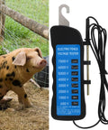 Ranch Ready Heavy Duty Electric Fence Voltage Tester Highlighting Eight Bright Neon Readings From 600 To 7000 Volts next to a pig in a farm setting.