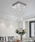 Dope Chrome Modern Crystal Raindrop Chandelier Flush Mount LED Ceiling Light Fixture in a dining room setting