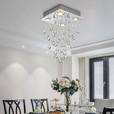 Dope Chrome Modern Crystal Raindrop Chandelier Flush Mount LED Ceiling Light Fixture in a dining room setting