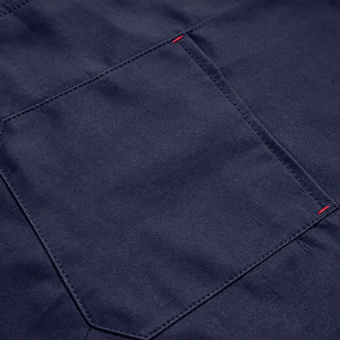 Close-up of pocket detail on Mens Heavy Duty Mechanic Lab Coat With Reflective Safety Strips Breathable Navy Workshop Uniform.